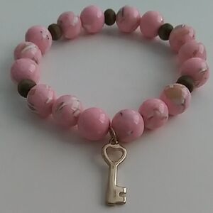New. Pink Beaded Bracelet with Gold Key Charm.